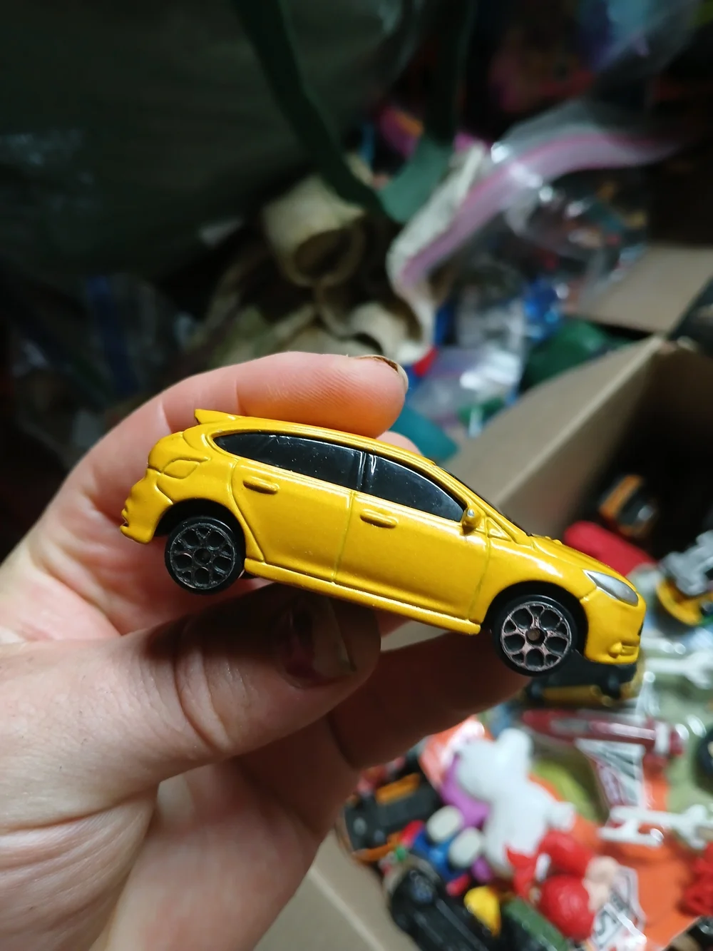 yellow 1:64 scale Maisto Ford Focus ST die-cast toy car